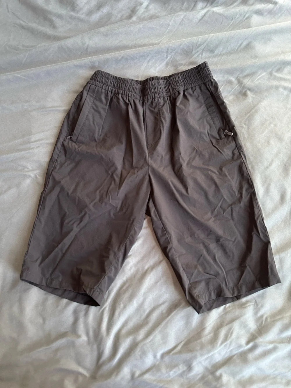 Black long nylon tech shorts, size M/L